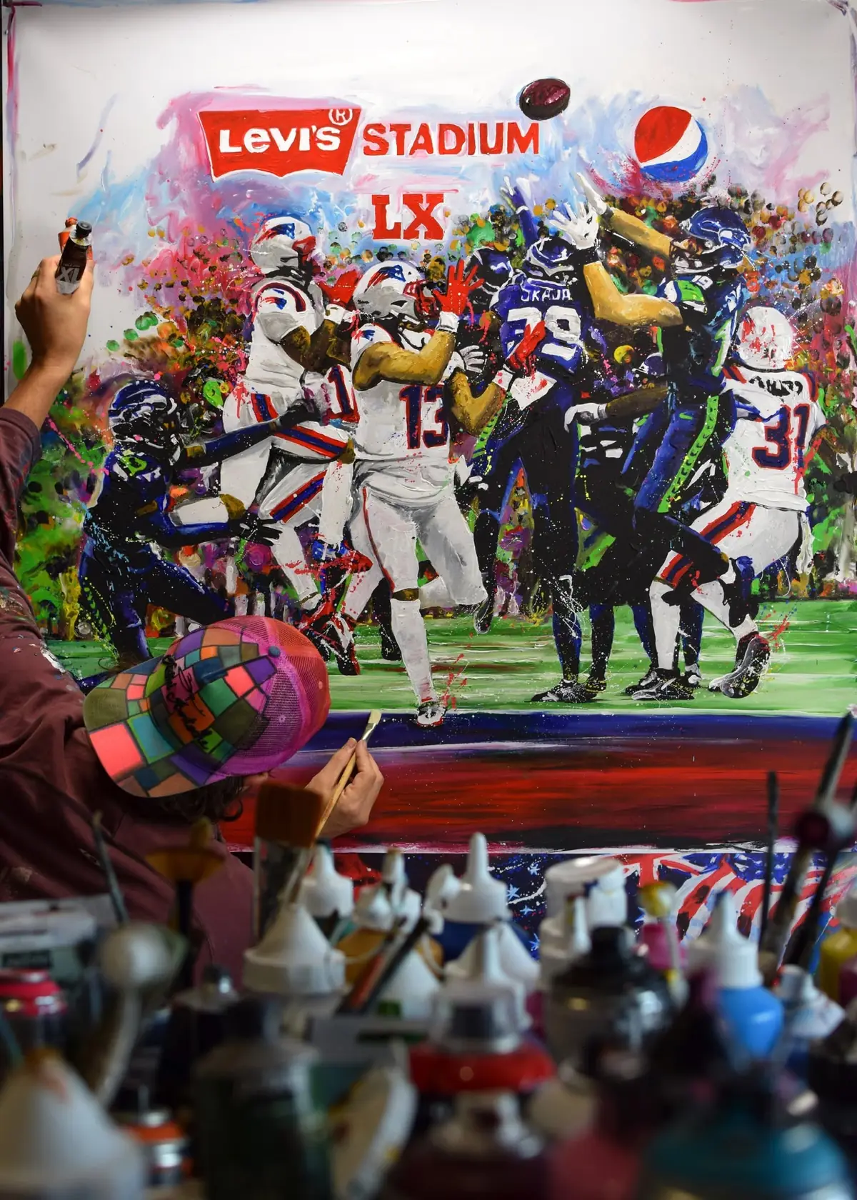 Peinture NFL en cours dans l’atelier de Rémi Bertoche